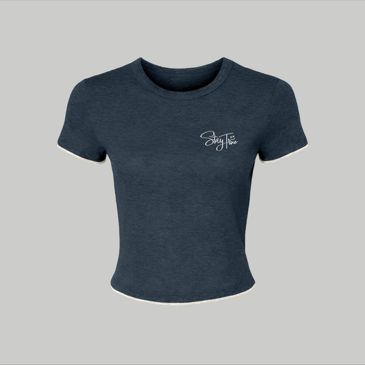Navy blue t-shirt with a logo on a gray background