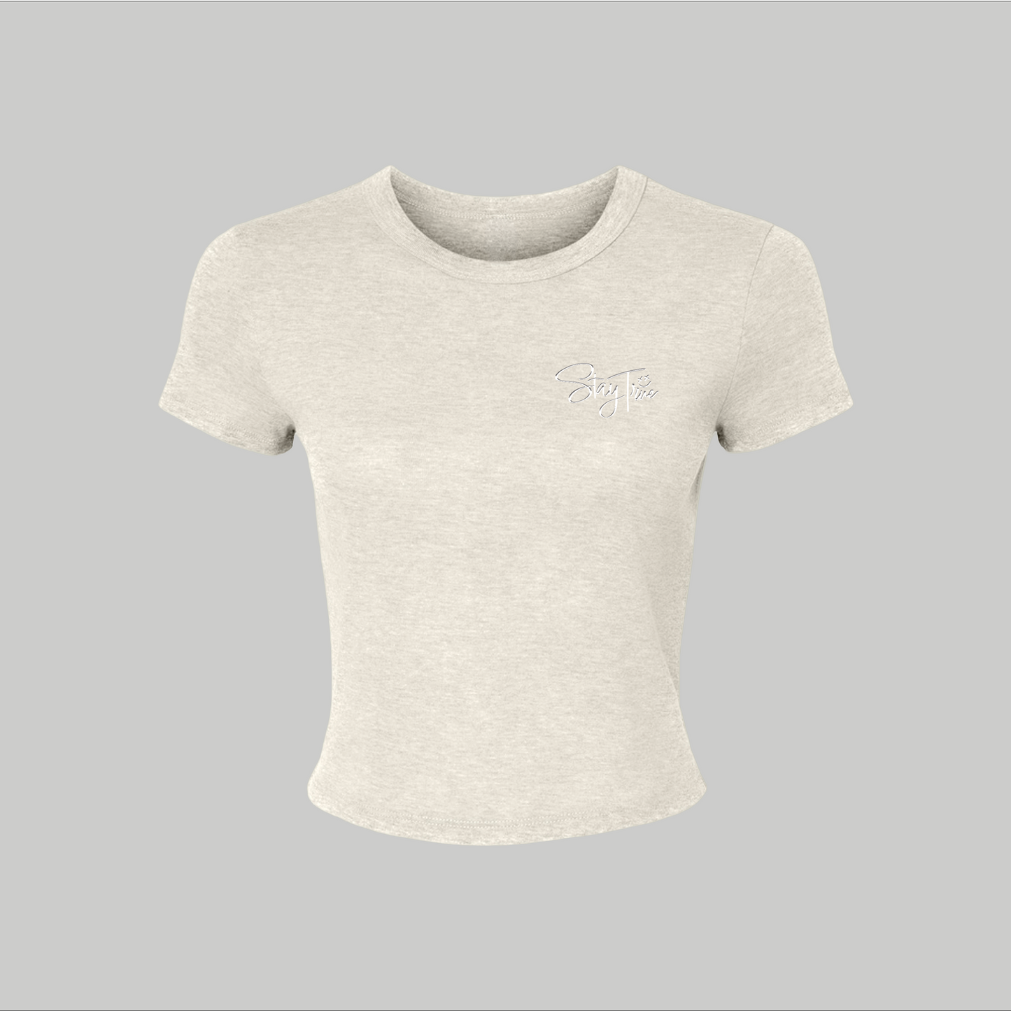Beige crop top with a logo on a gray background