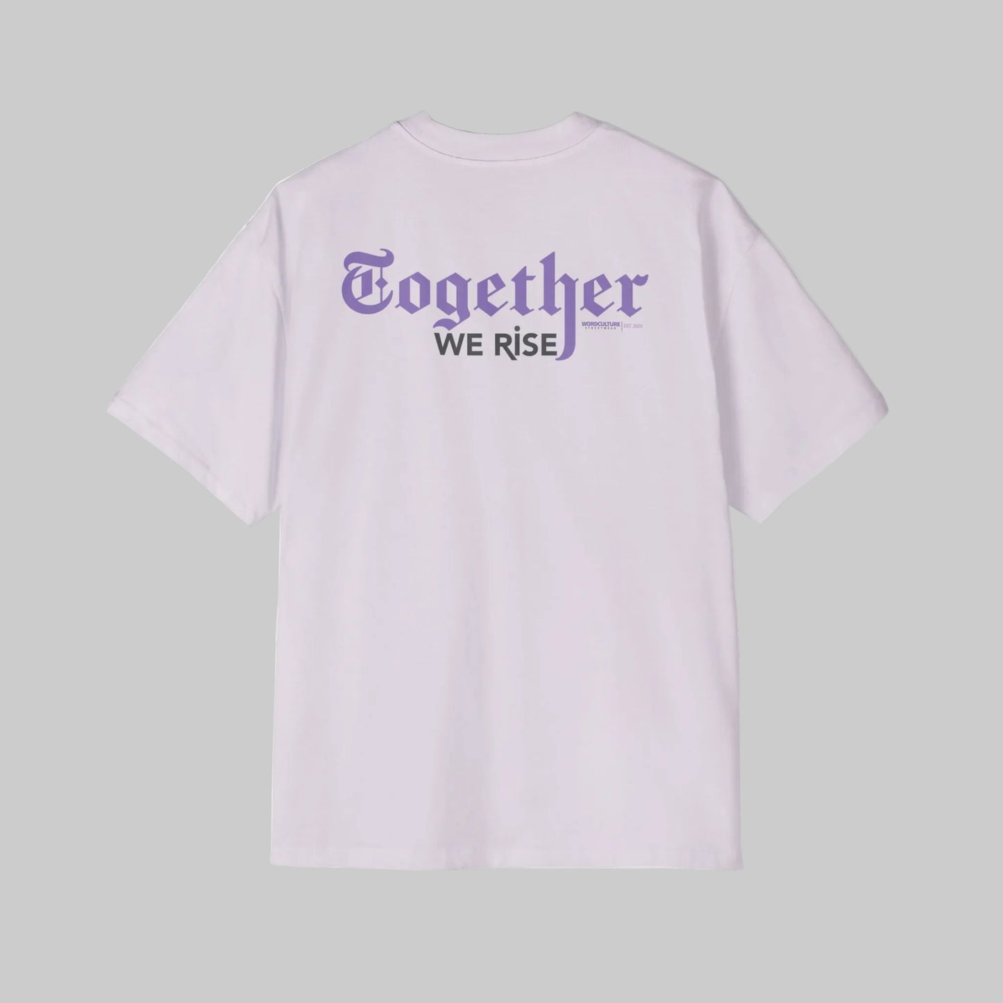 Light purple oversized t-shirt with 'Together We Rise' text on the back against a gray background.