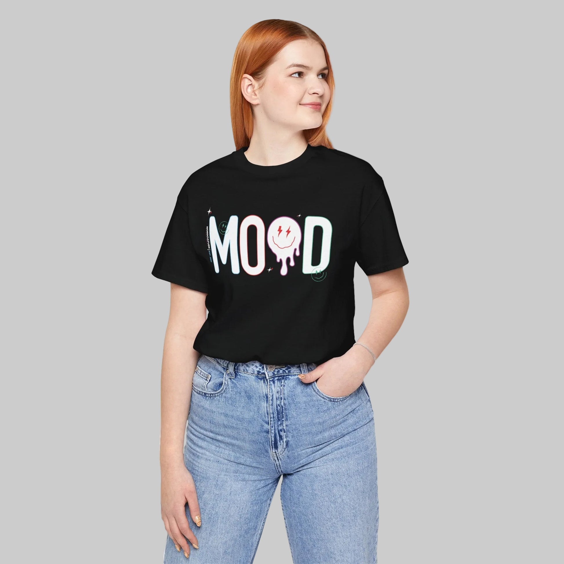 Person wearing a black t-shirt with 'MOOD' text and blue jeans on a white background by WordCulture.