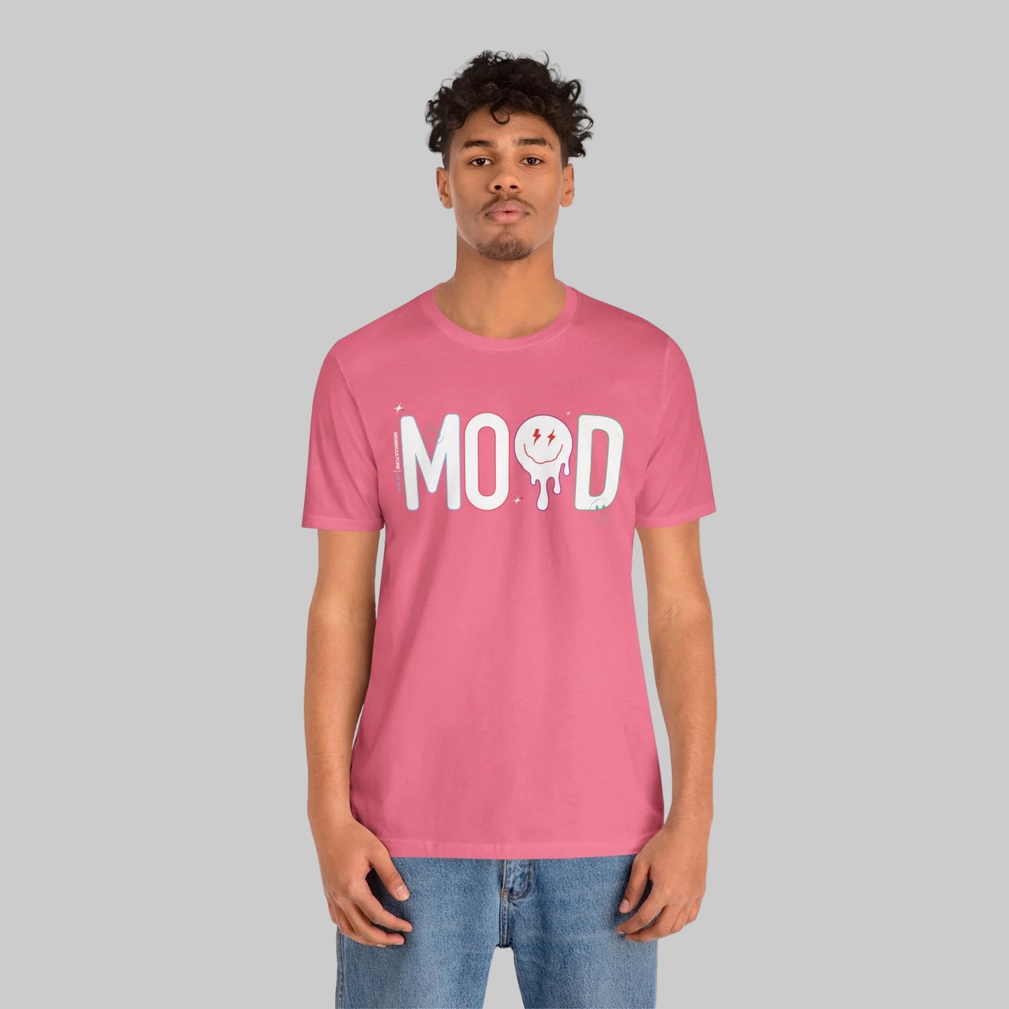 Person wearing a pink t-shirt with 'MOOD' print on a white background by WordCulture Streetwear.