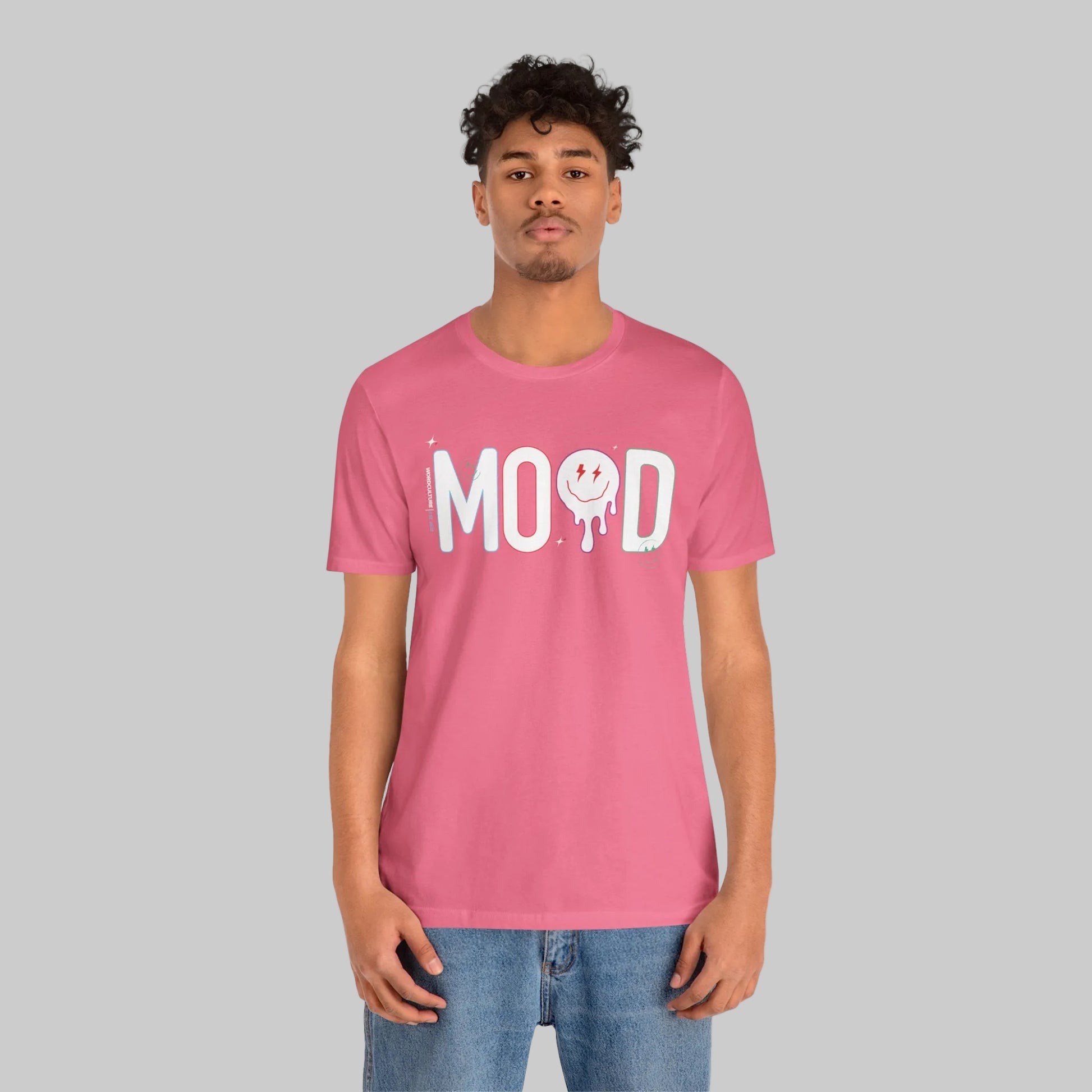 Person wearing a pink t-shirt with 'MOOD' print on a white background by WordCulture Streetwear.