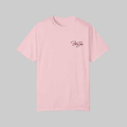 Pink t-shirt with 'Stay True' text on a gray background