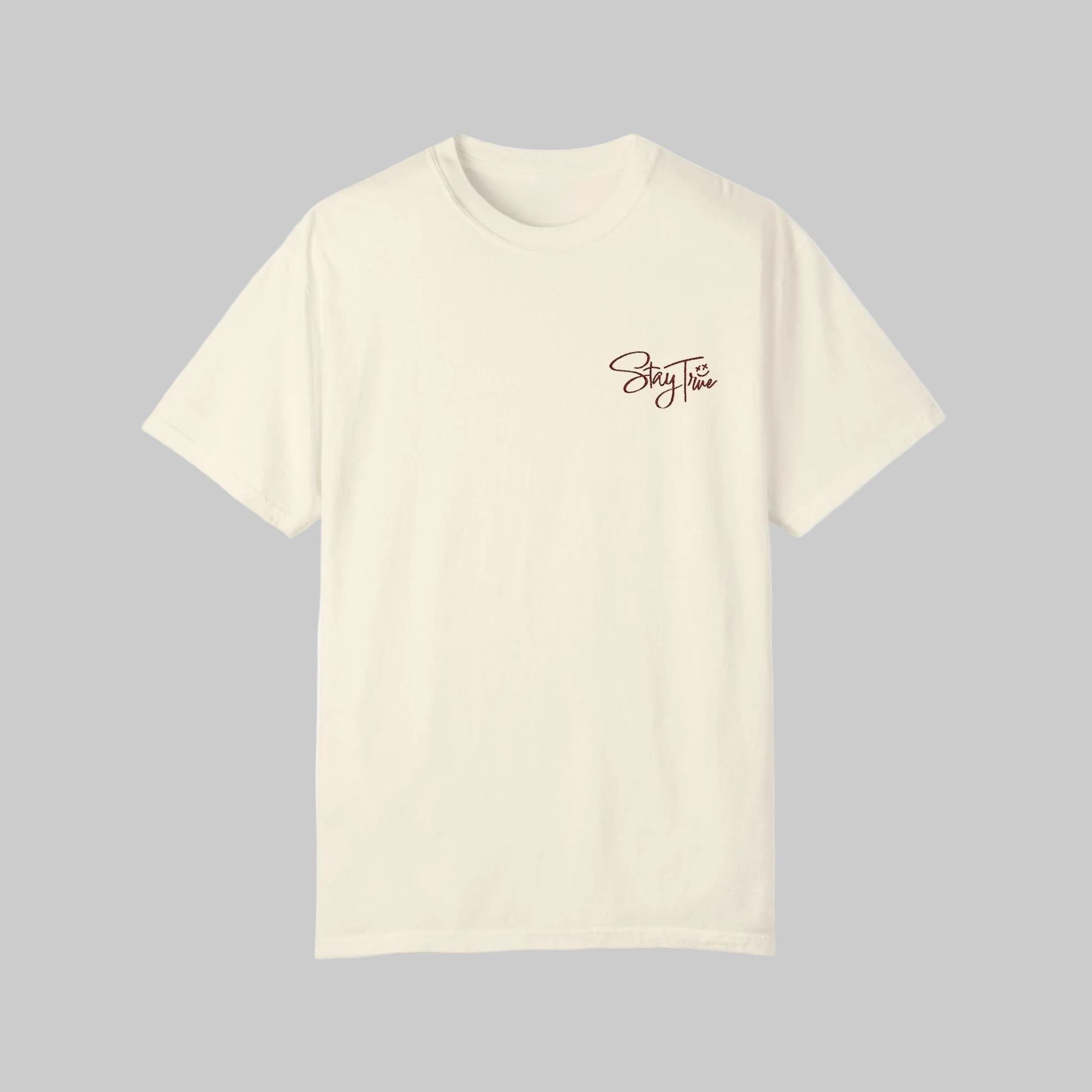 Beige t-shirt with 'Stay True' text on a gray background