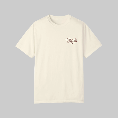 Beige t-shirt with 'Stay True' text on a gray background