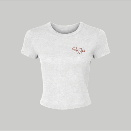 White t-shirt with a logo on a gray background