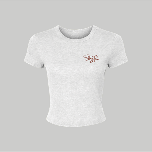 White t-shirt with a logo on a gray background
