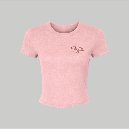 Pink t-shirt with a stay true embroidered on a gray background
