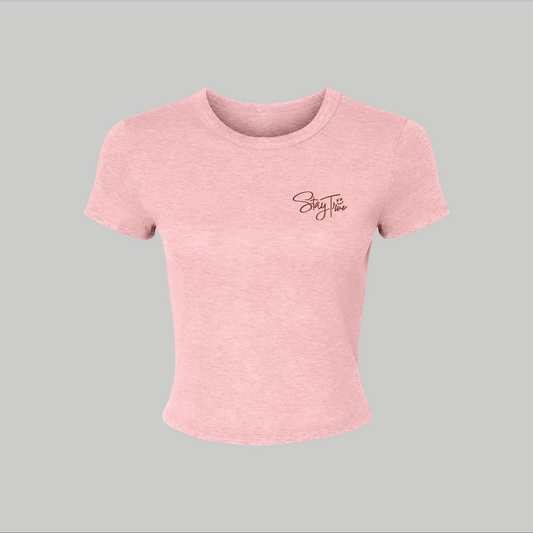 Pink t-shirt with a stay true embroidered on a gray background
