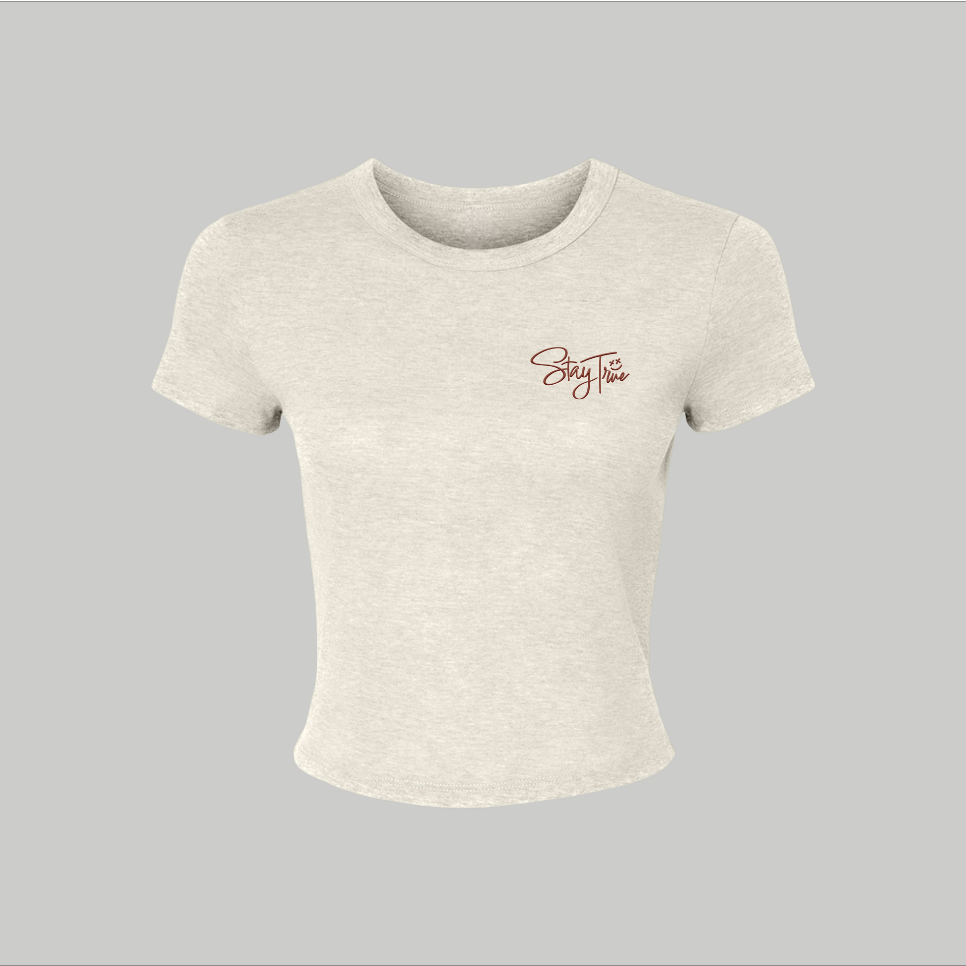 Beige crop top with a logo on a gray background