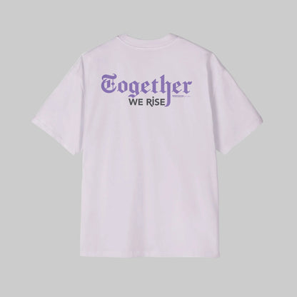Light purple oversized t-shirt with 'Together We Rise' text on the back against a gray background. 